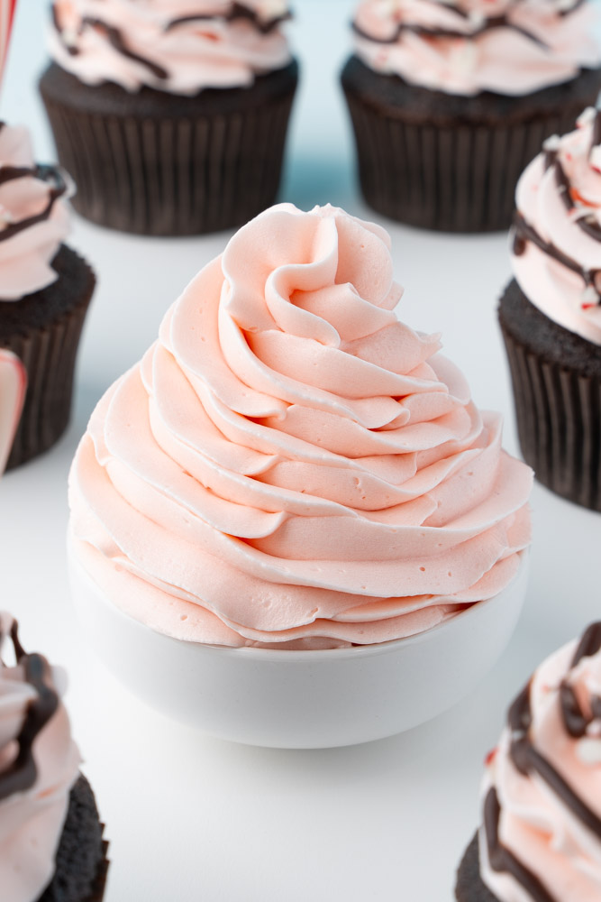 Buttercream frosting made with crushed peppermint candies for peppermint flavor and a pink color.