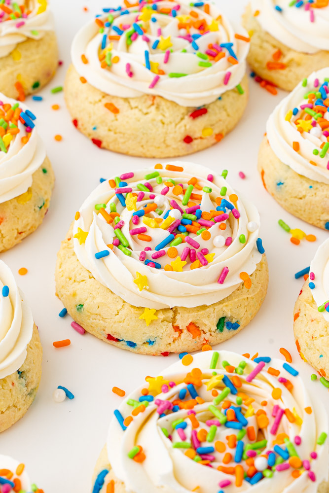 Funfetti cake mix cookies with vanilla buttercream frosting and colorful sprinkles.
