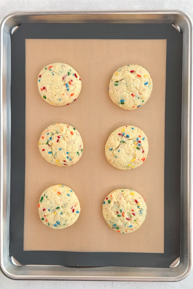 Baked cookies on a baking sheet pan.