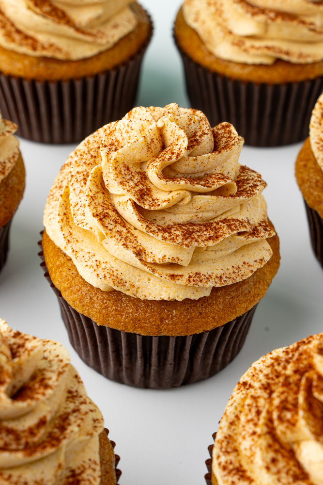 Pumpkin cupcakes with pumpkin buttercream frosting.