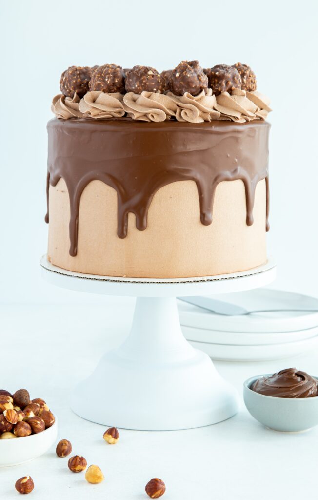 chocolate hazelnut cake on a cake stand