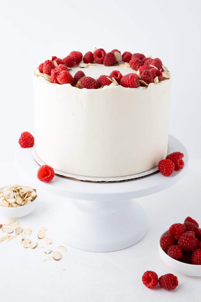 raspberry almond cake on cake stand