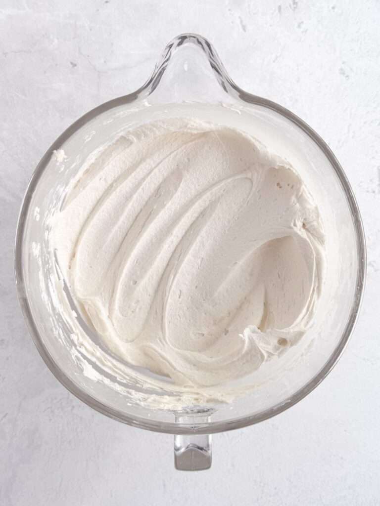 Cake batter buttercream frosting in a mixing bowl.