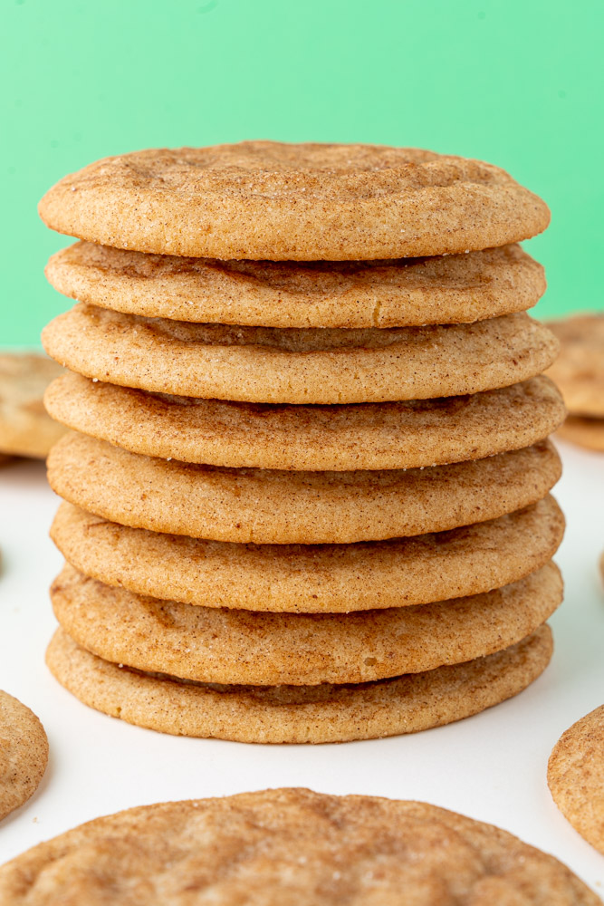 A stack of cookies covered in cinnamon sugar.