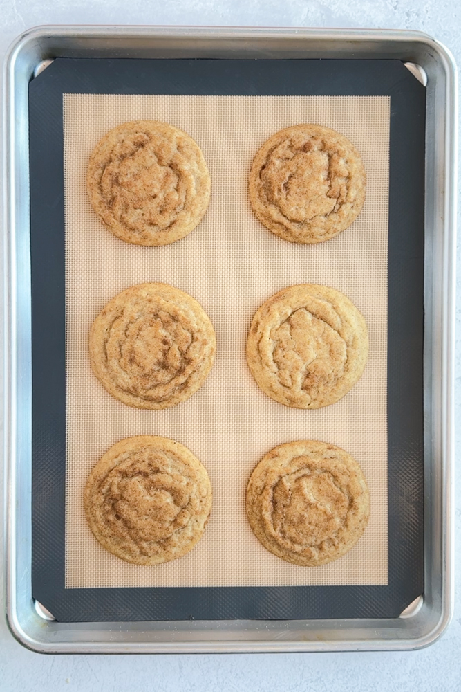 Baked cookies on a baking sheet pan.