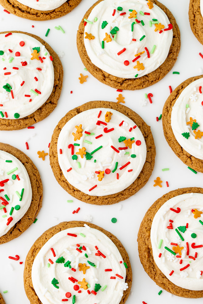 Easy gingerbread cookies with cream cheese frosting and holiday sprinkles.
