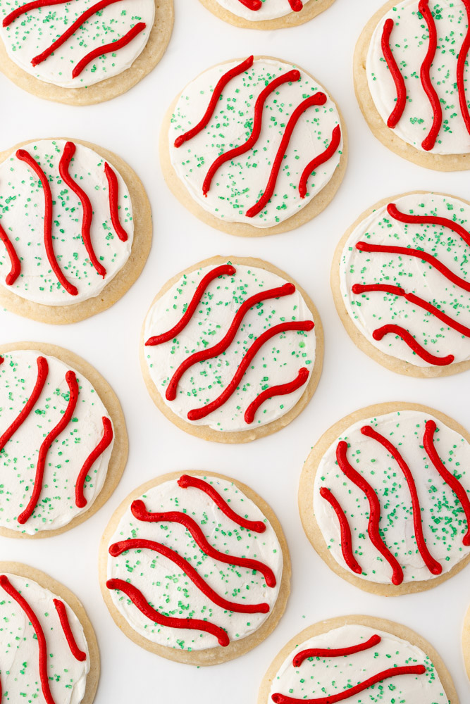 Vanilla cookies with vanilla frosting and decorated like Little Debbie Christmas tree snack cakes.