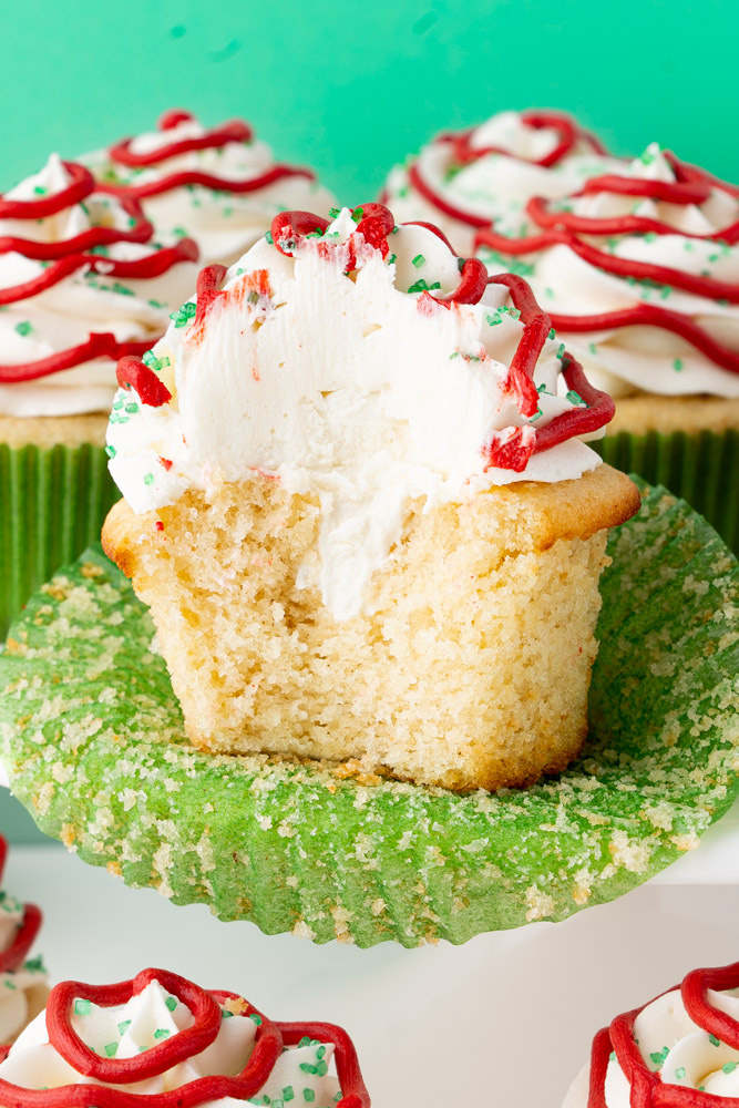 A cross-section of one of the Little Debbie Christmas tree cupcakes to show the cream filling and the texture of the cupcake.