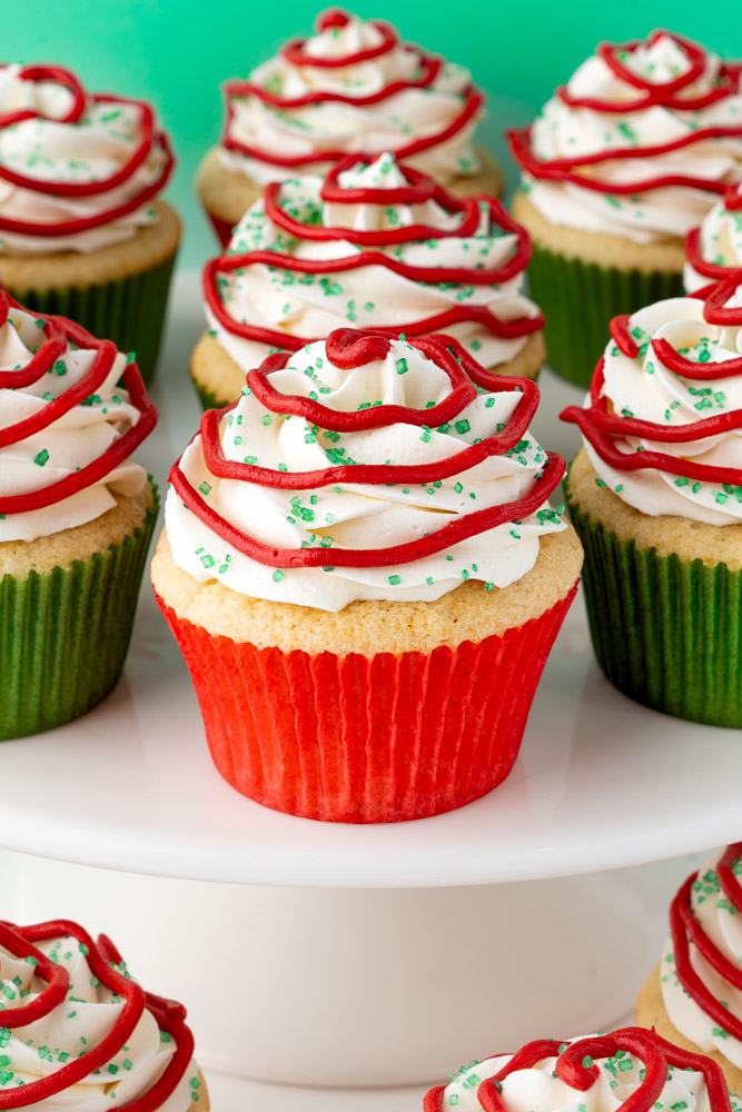 Little Debbie Christmas tree cupcakes on a cake stand.