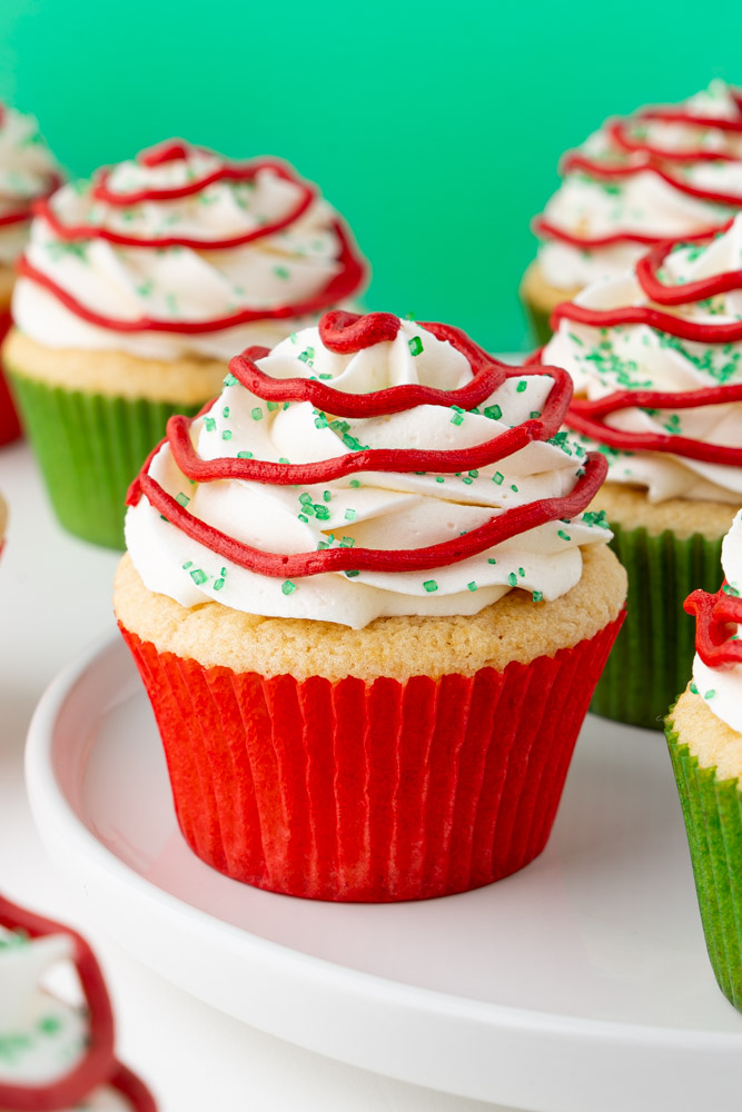 Little Debbie Christmas tree cupcakes inspired by nostalgic snack cakes on a plate.