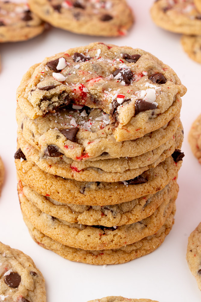 A stack of cookies with a bite taken out of the top cookie to show the interior.