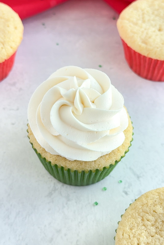 A vanilla cupcake frosted with vanilla buttercream frosting.