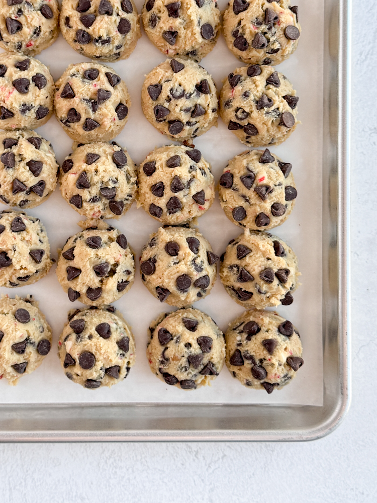 Portioned cookie dough with semisweet chocolate chips.