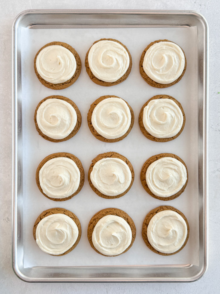 Gingerbread cookies frosted with cream cheese frosting.
