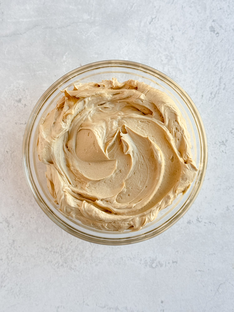 Coffee buttercream frosting in a mixing bowl.