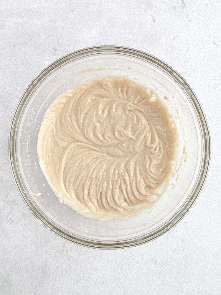 Vanilla cupcake batter in a mixing bowl.