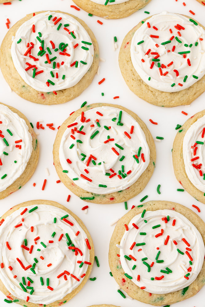 Vanilla sugar cookies iced with vanilla frosting and topped with red, white, and green sprinkles.