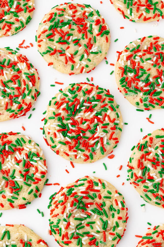 Holiday sugar cookies covered in Christmas sprinkles.