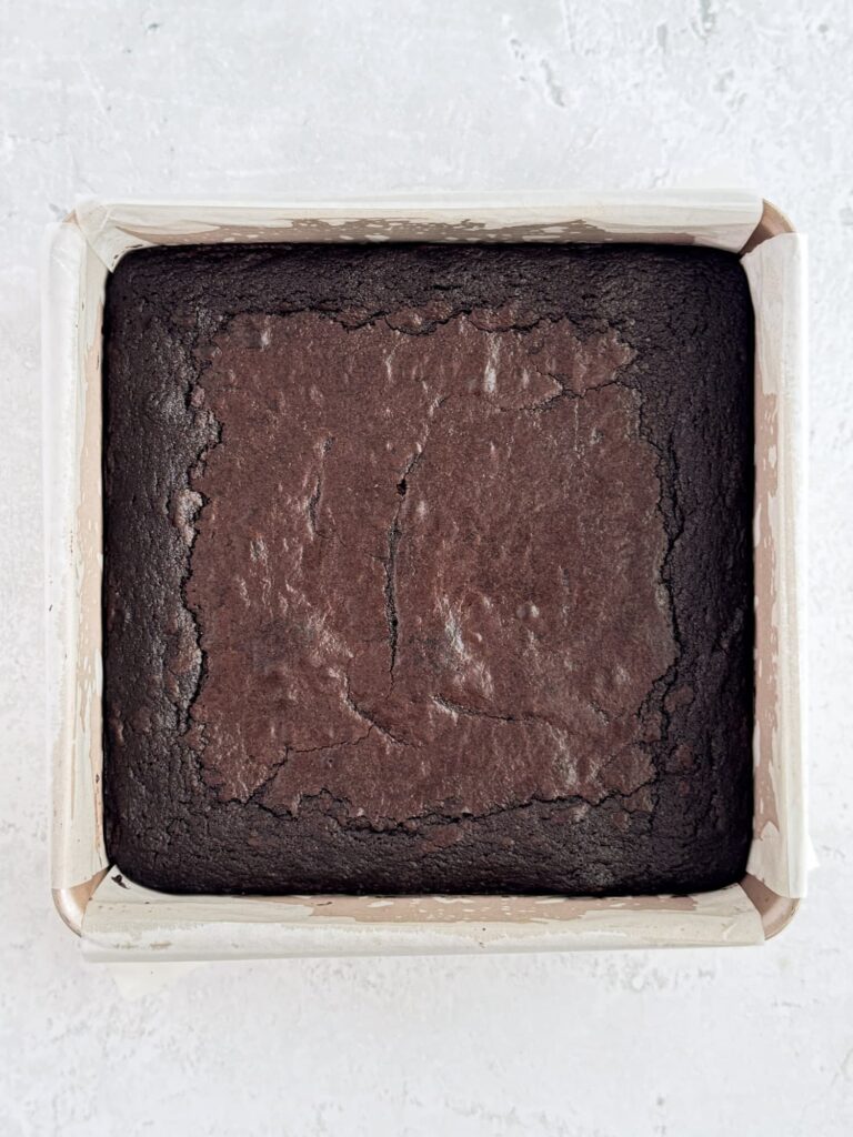 Baked brownies in a baking pan.