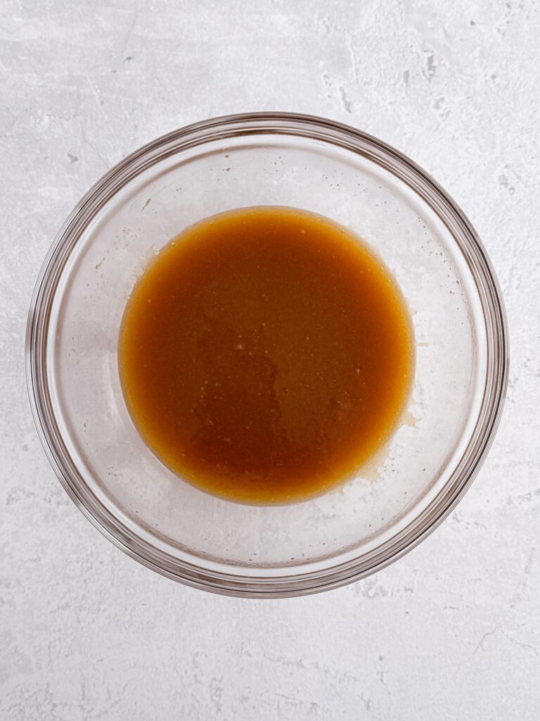 Brown sugar and butter mixture in a glass bowl.