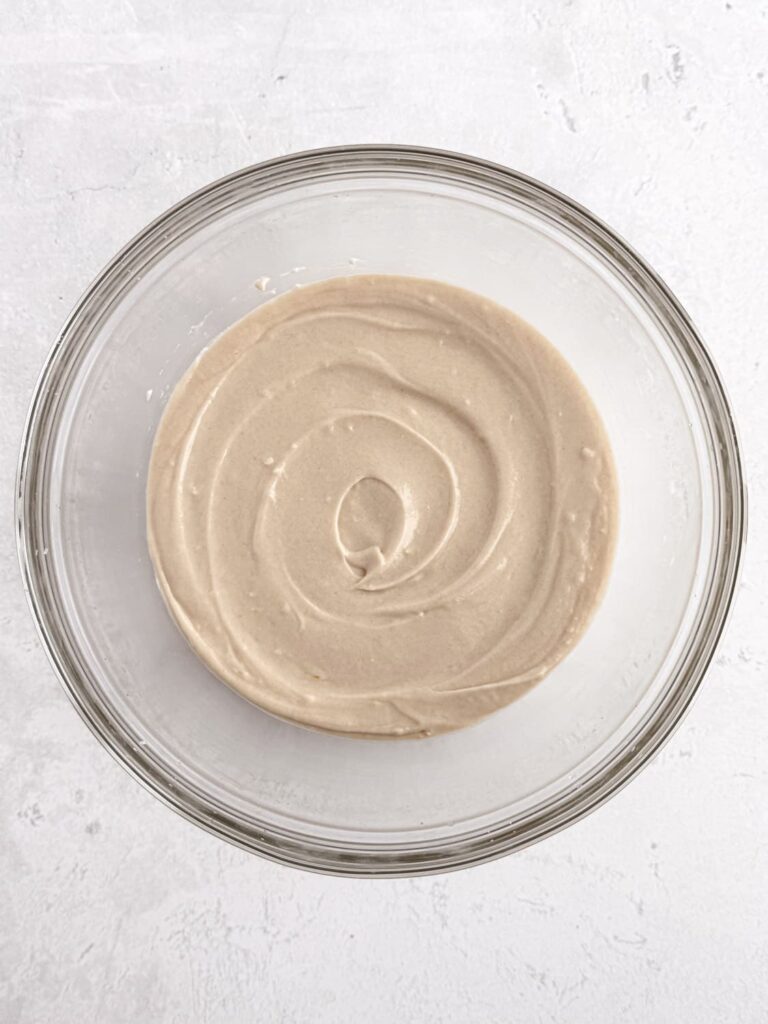 Vanilla cupcake batter in a mixing bowl.