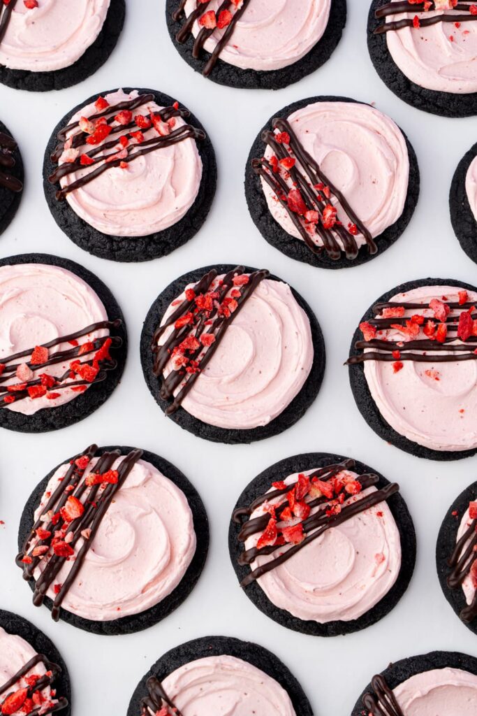 Dark chocolate cookies with strawberry frosting and chocolate ganache.