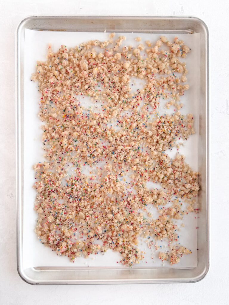 Birthday cake crumbs on baking pan.