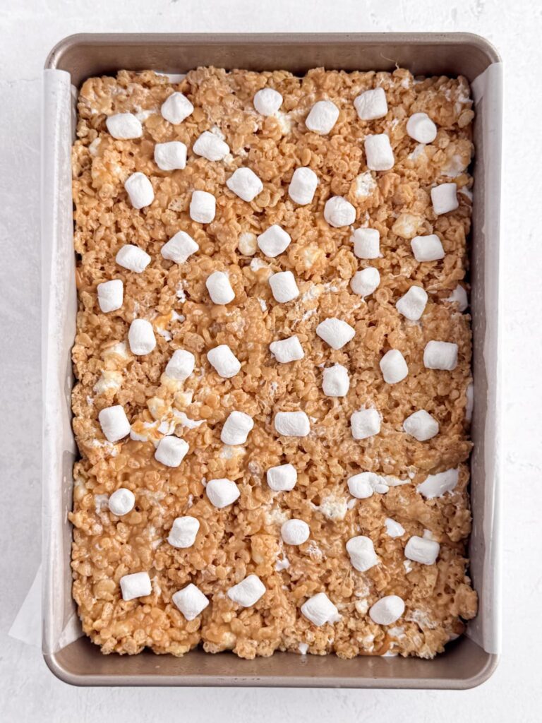 Mini marshmallows pressed into the peanut butter Rice Krispie treat bars.