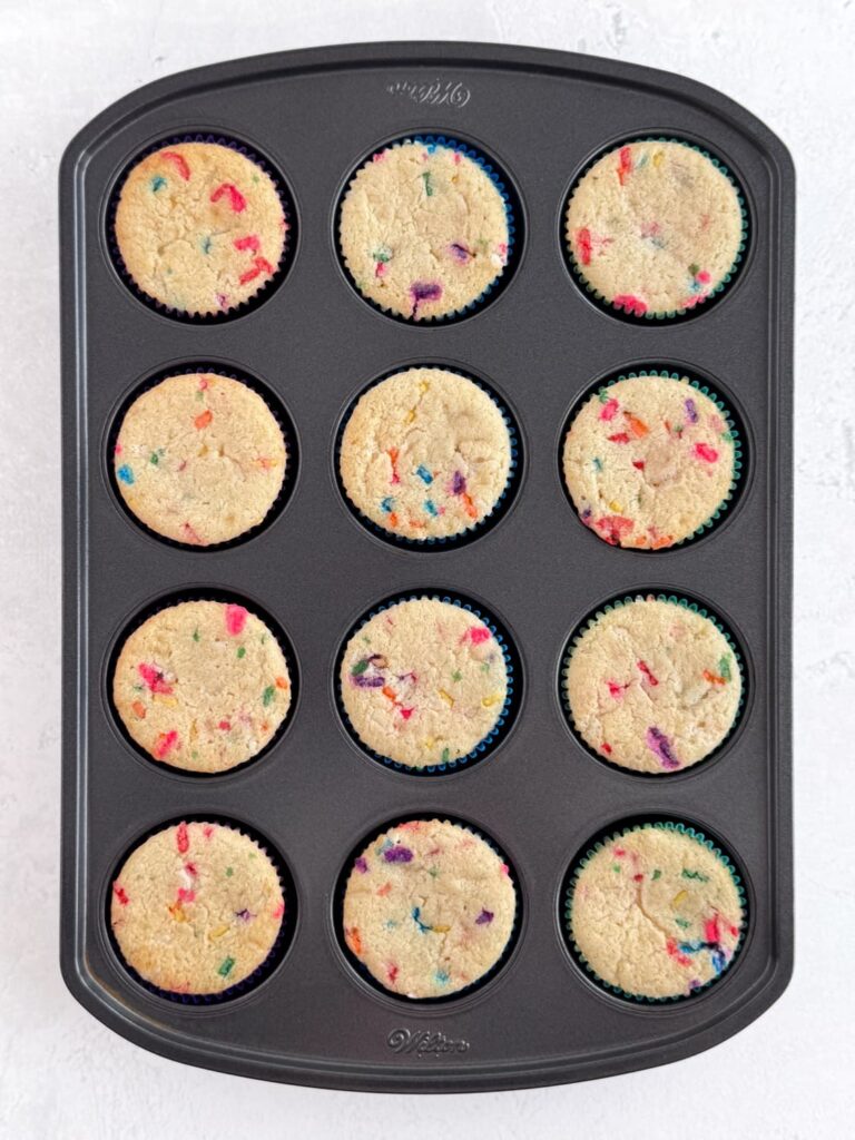 Baked funfetti cupcakes in a cupcake pan.