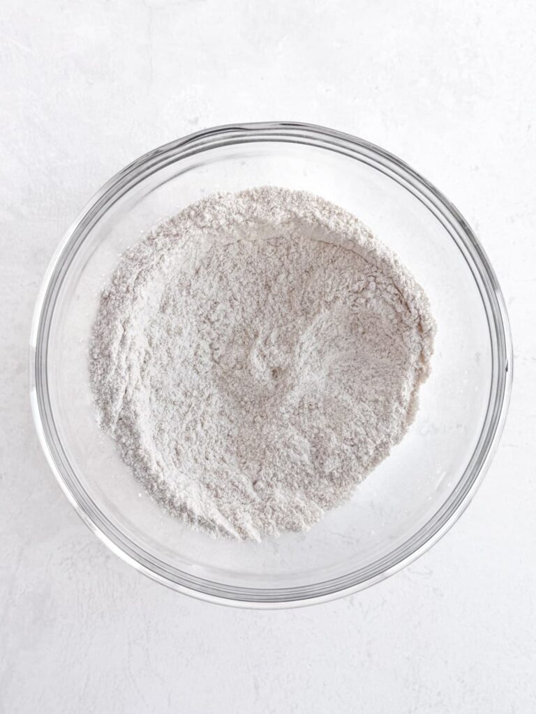 The dry ingredients for the recipe in a mixing bowl.