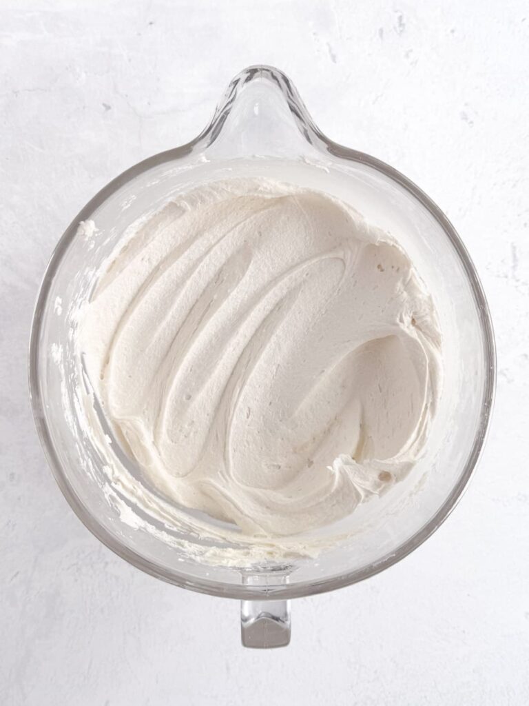 Cake batter buttercream frosting in a mixing bowl.