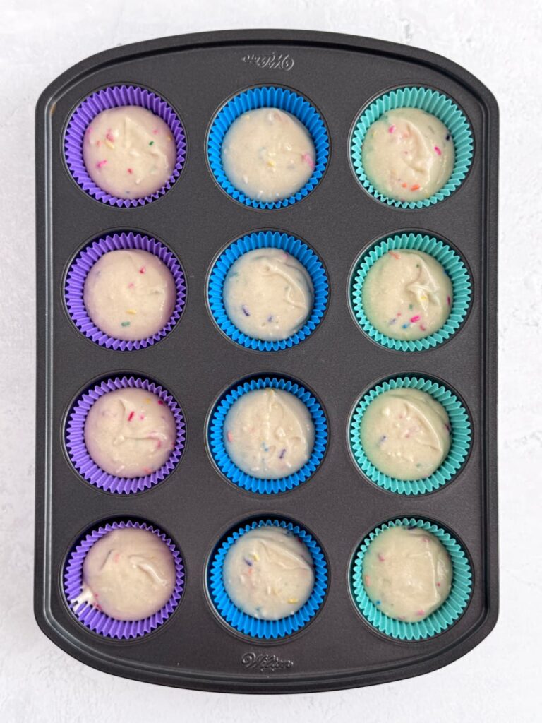 Funfetti cupcake batter in cupcake liners.