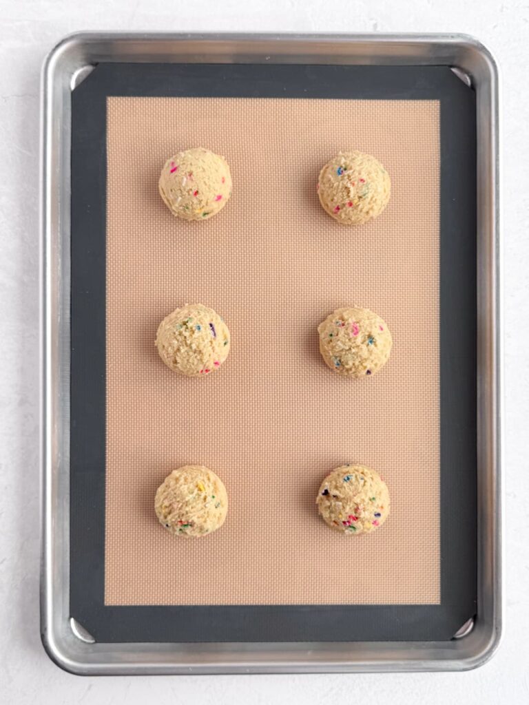 Chilled funfetti sugar cookie dough on baking sheet pan.