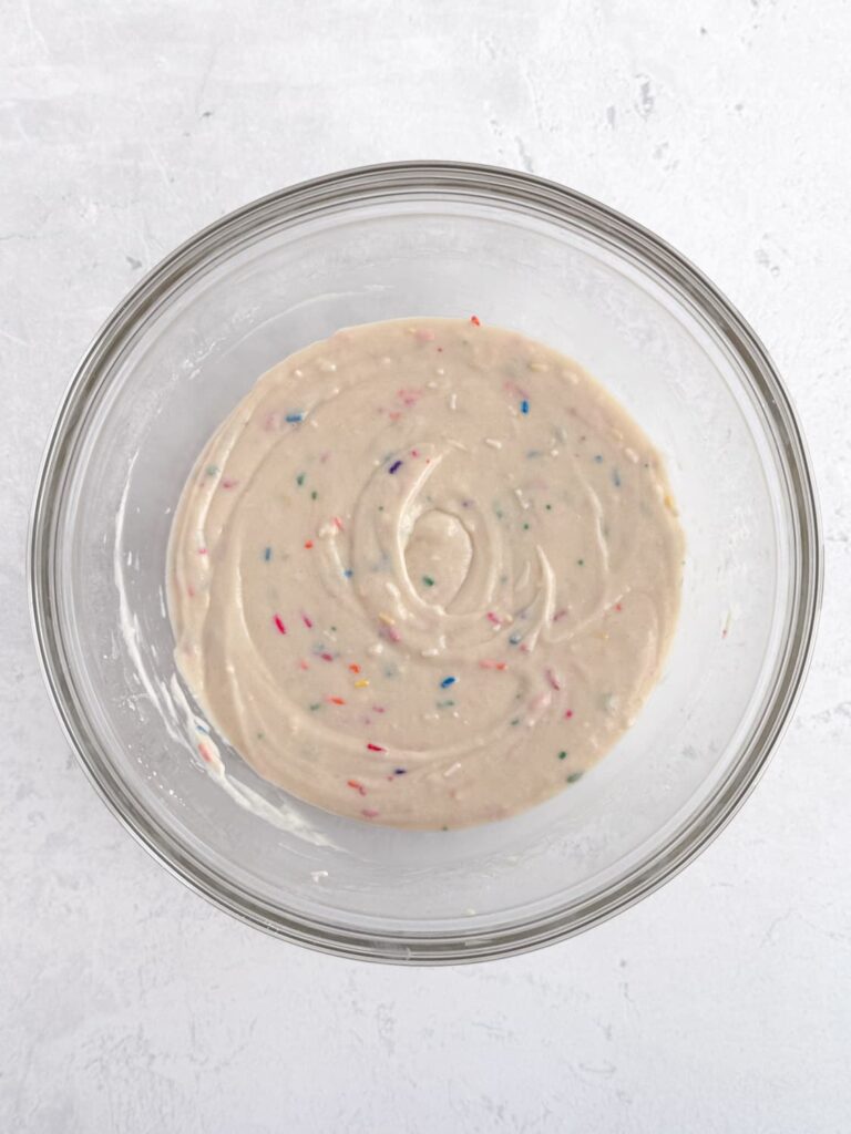 Funfetti cupcake batter in a mixing bowl.