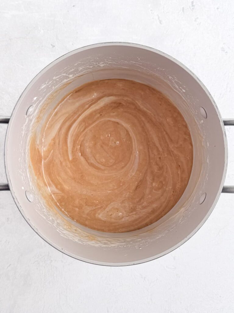 Marshmallow and peanut butter melted in a saucepan.