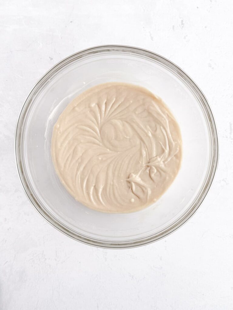 Vanilla almond cupcake batter in a mixing bowl.