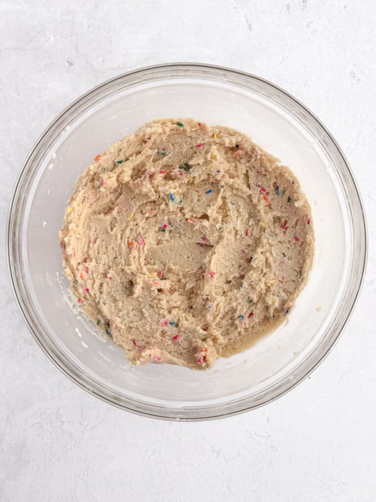Funfetti sugar cookie dough in a mixing bowl.