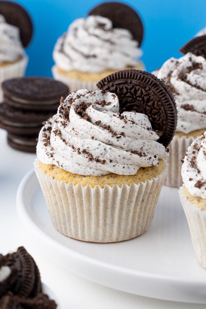 Vanilla cookies and cream cupcakes on a plate.