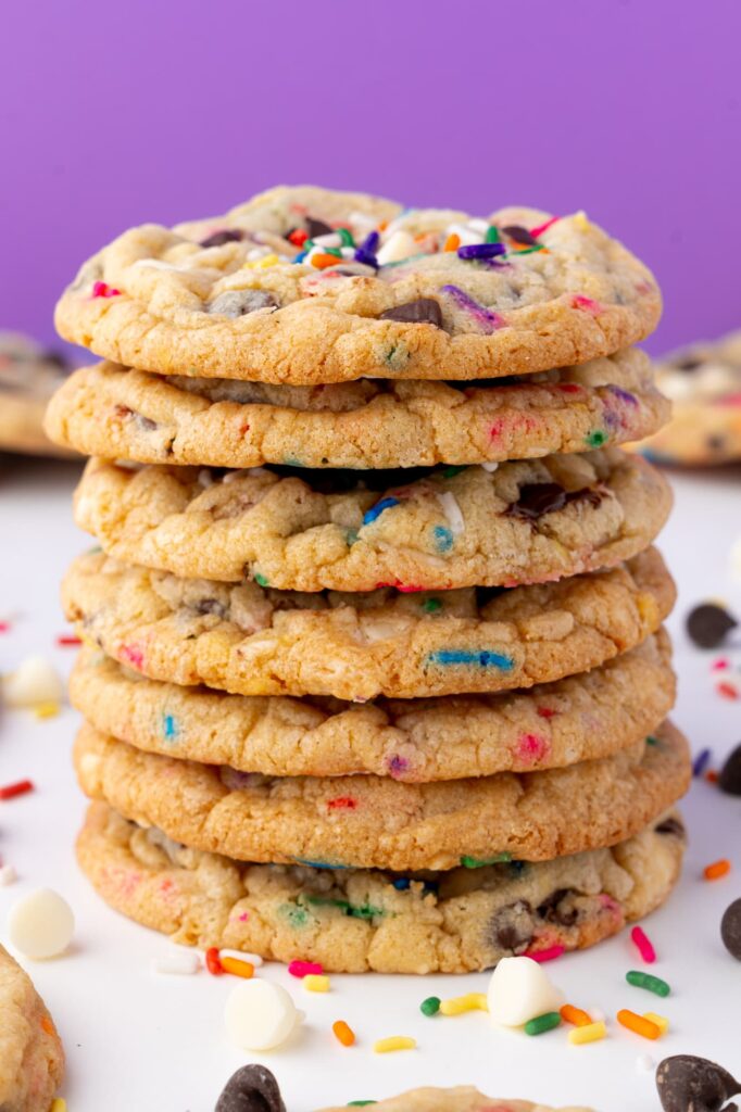 A stack of sprinkle cookies with chocolate chips.