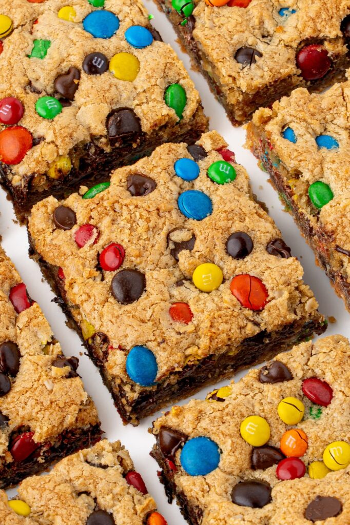 Cookie bars with peanut butter, oats, chocolate chips, and M&Ms.
