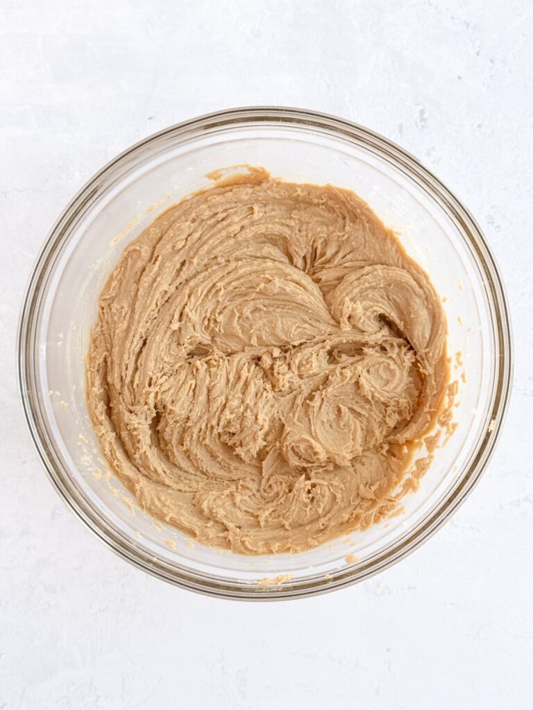 Peanut butter cookie dough in a mixing bowl.