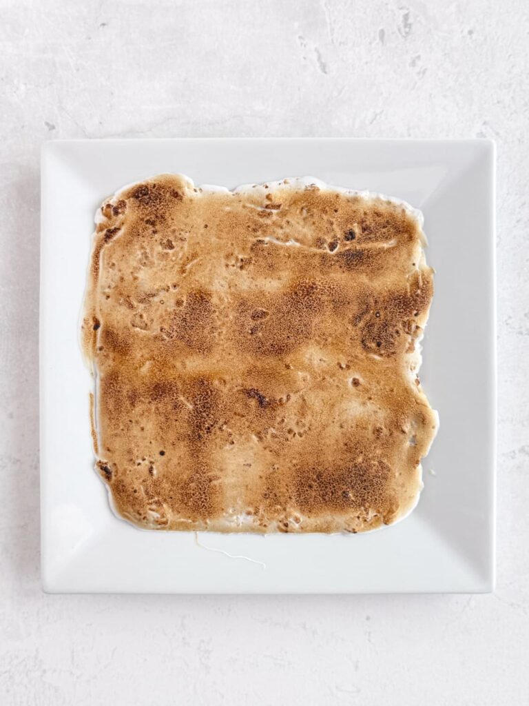 Toasted marshmallow fluffy on a plate.