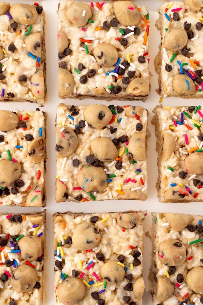 Cookie dough Rice Krispie treats with mini chocolate chips and rainbow sprinkles.
