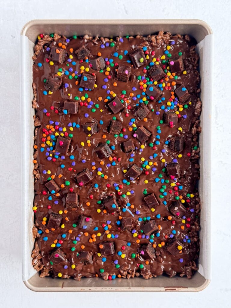 Finished cosmic brownie Rice Krispie treats in a baking pan.