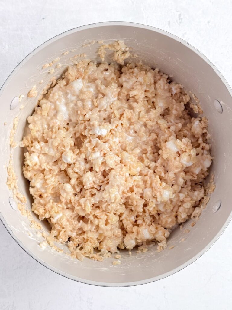 The crisp rice cereal marshmallow mixture in a sauce pan.