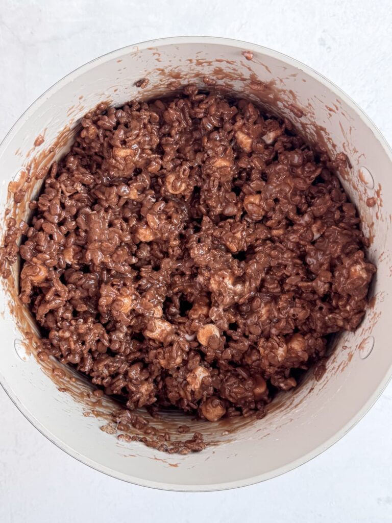 Chocolate and marshmallow treat mixture in a saucepan.