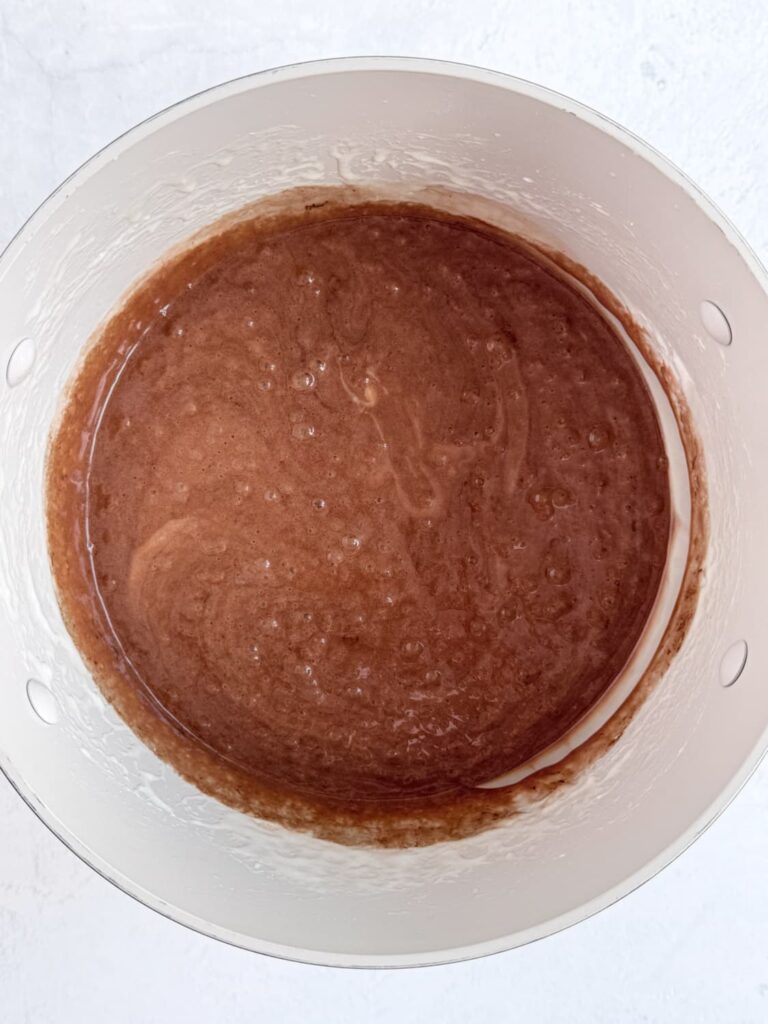 Melted chocolate marshmallows in a saucepan.