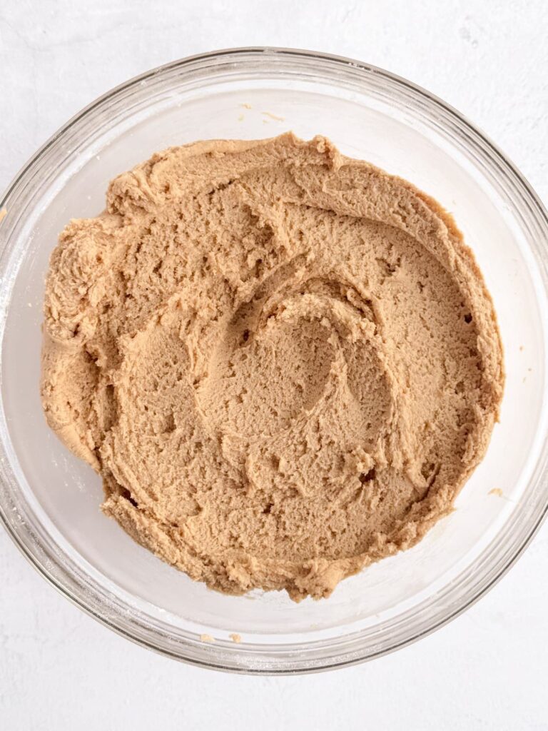 Peanut butter cookie dough in a mixing bowl.