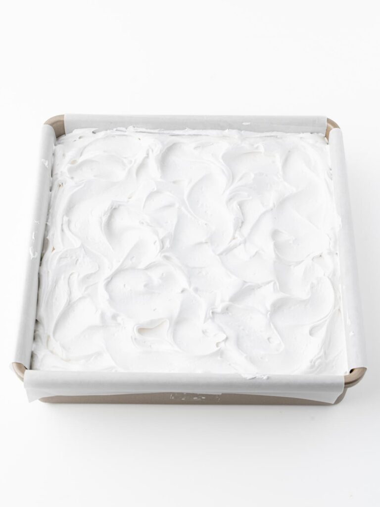 Marshmallow fluff spread on the bars.