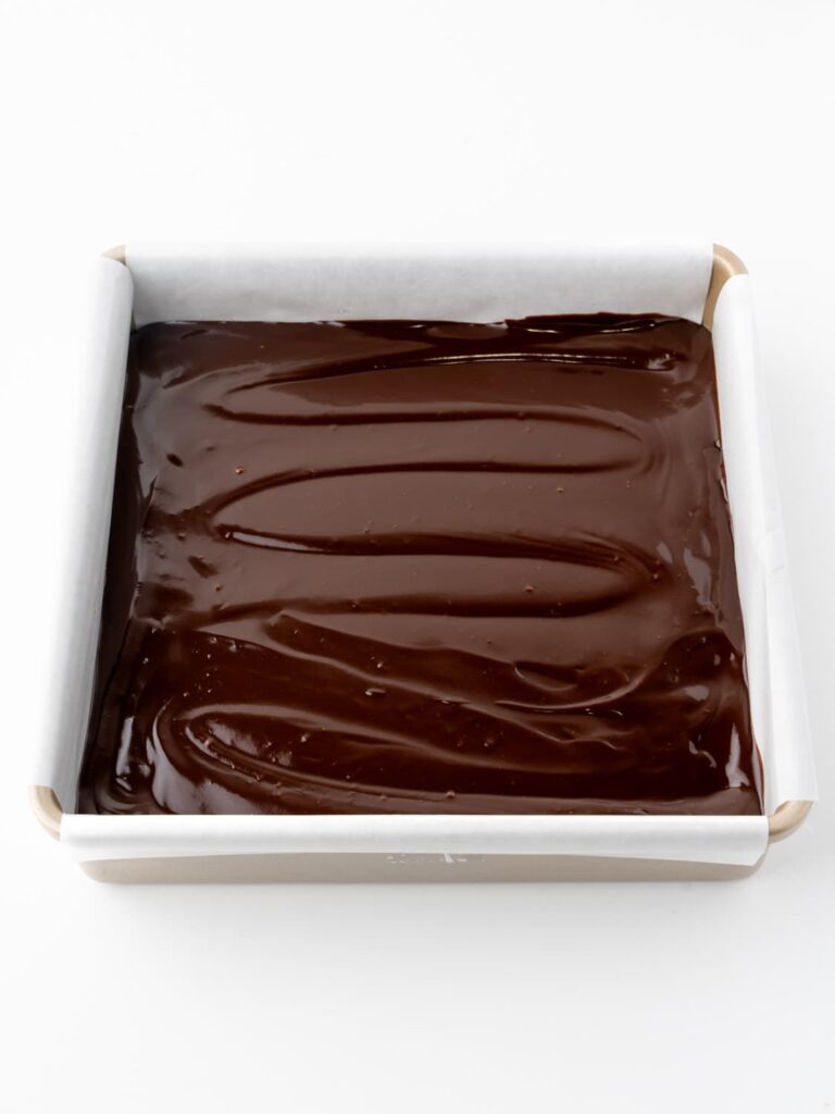 Chocolate ganache spread in a pan.